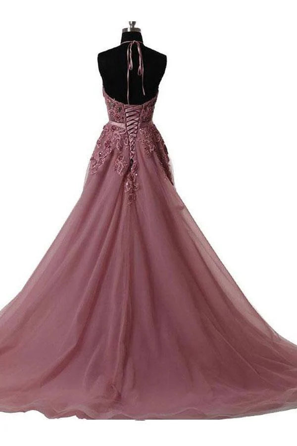Back view of a halter prom dress showcasing the long train.