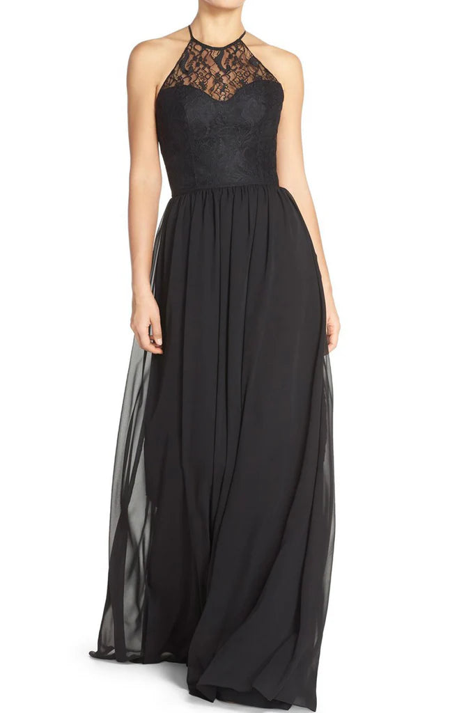 Woman wearing an elegant halter lace chiffon long bridesmaid dress.