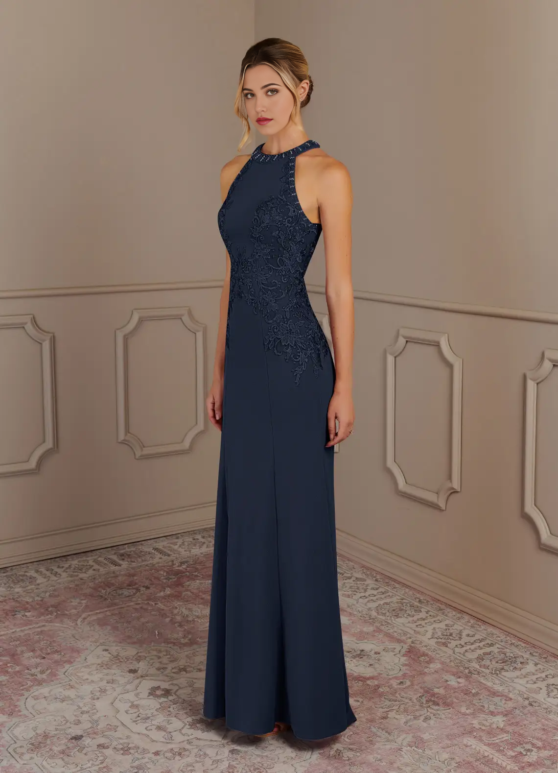 Woman posing gracefully in the dark navy Mother of the Bride dress.