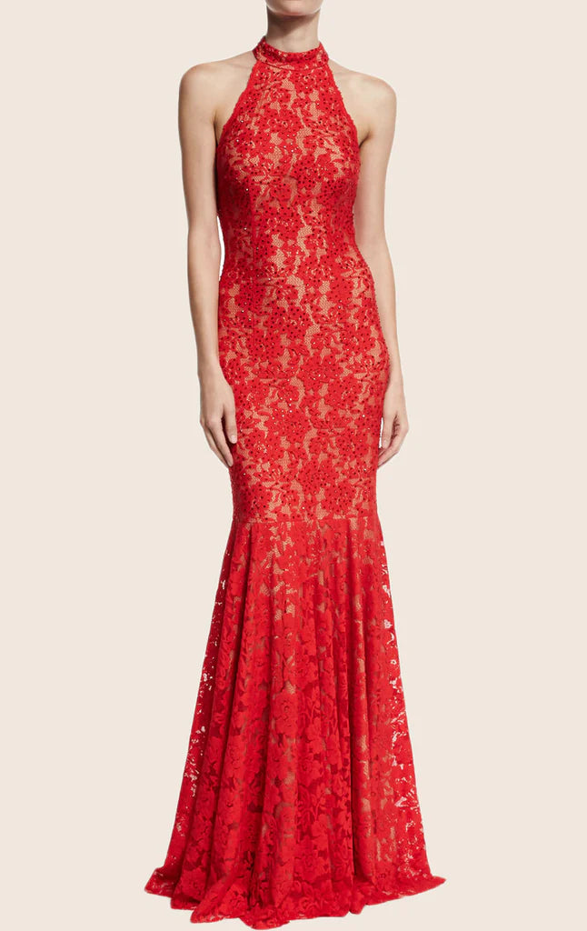 Woman wearing an elegant mermaid halter lace evening gown.
