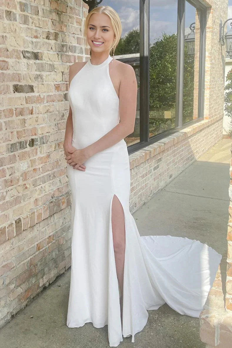 Elegant mermaid halter wedding dress with a high slit.