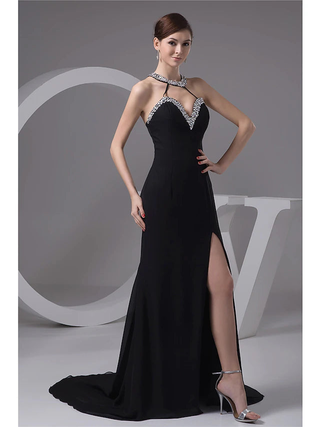 Back view of the mermaid trumpet evening gown, showcasing the court train and halter neckline.