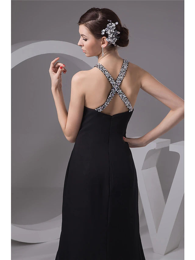 Close-up of the beaded detailing on the bodice of the halter evening gown.