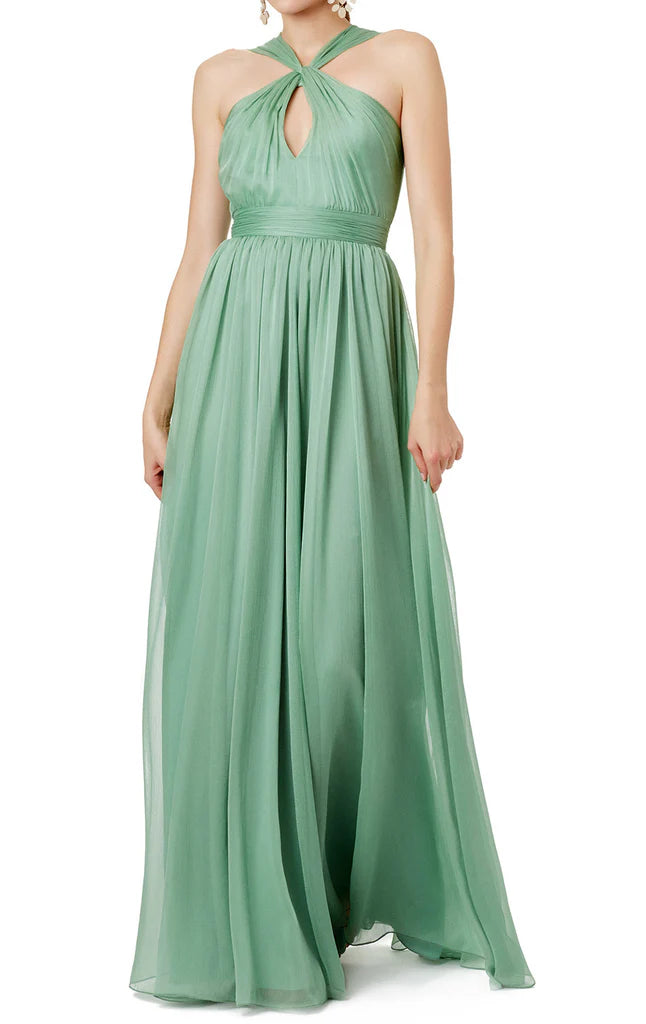 Woman wearing an elegant halter neck chiffon maxi dress.