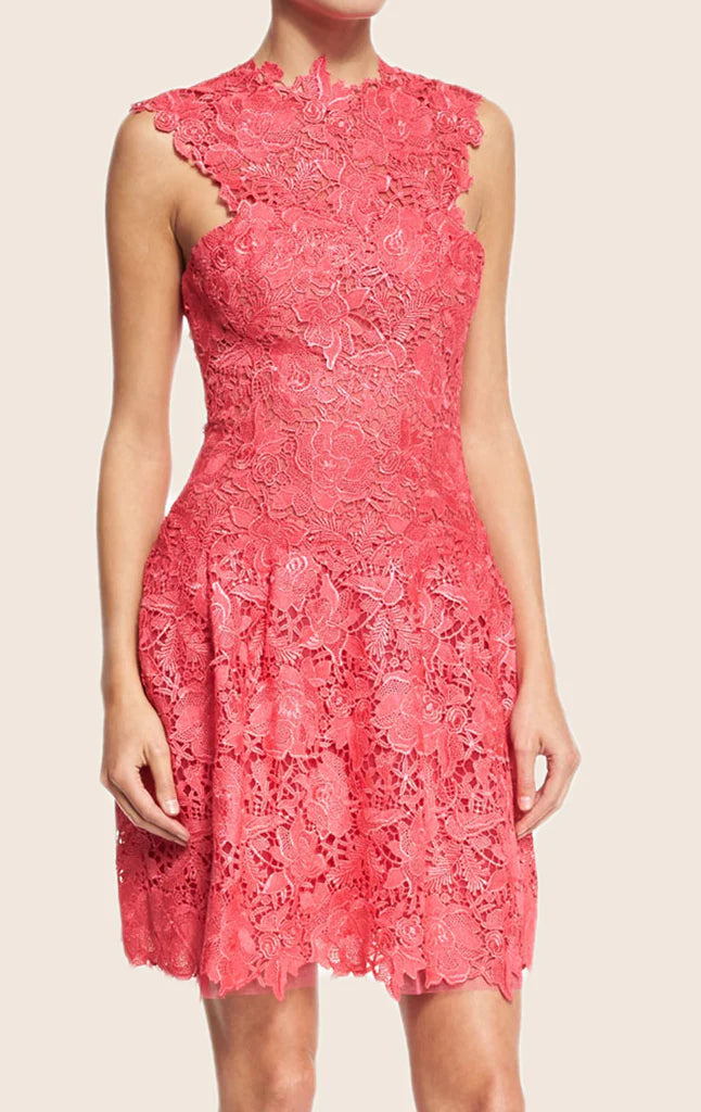 Woman wearing an elegant halter neck lace prom dress.