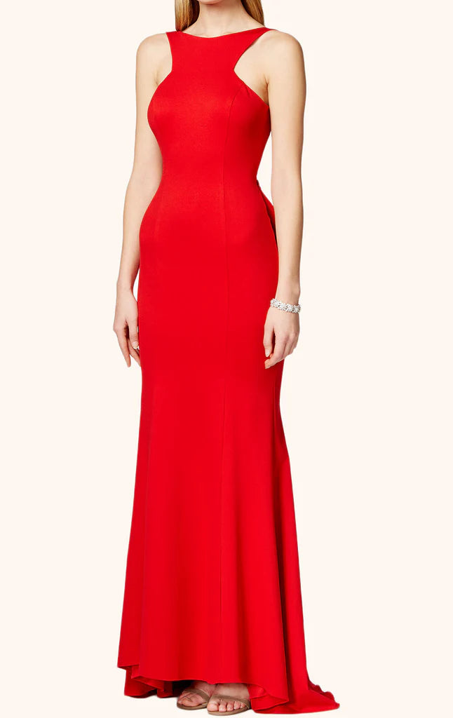 Woman wearing an elegant halter neck long prom dress.