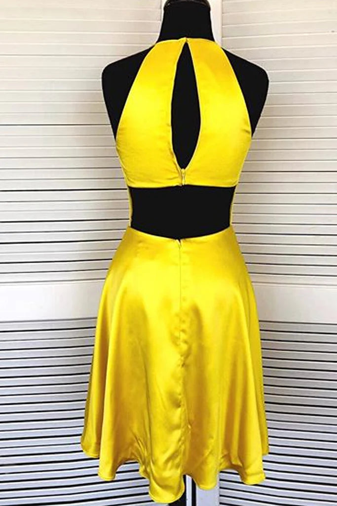Model showcasing the back of a red halter neck satin mini dress.