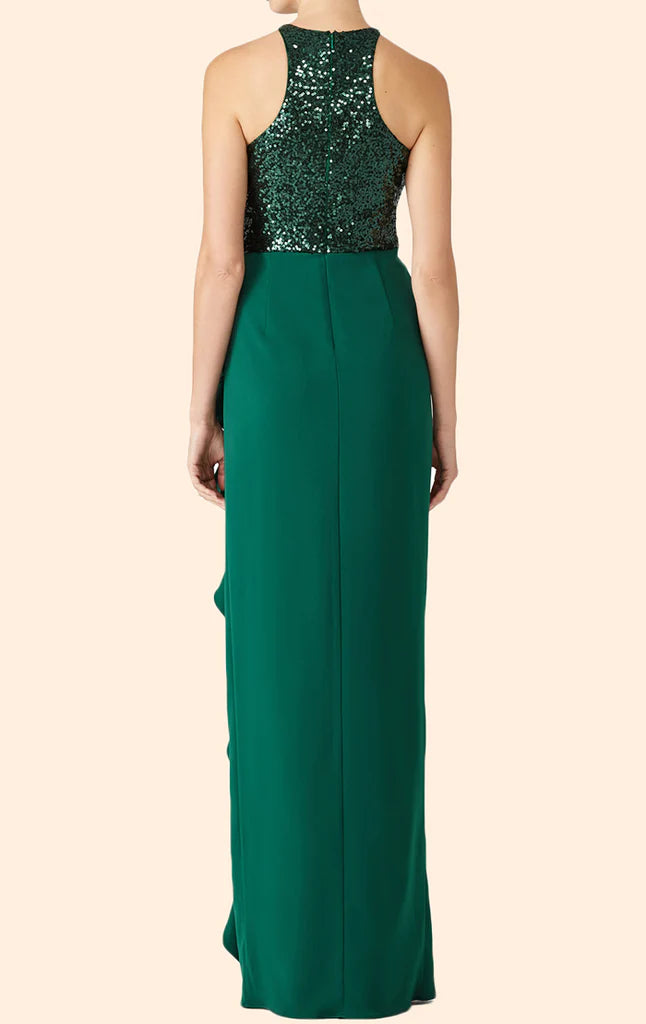Model posing in a shimmering halter sequin chiffon formal dress.