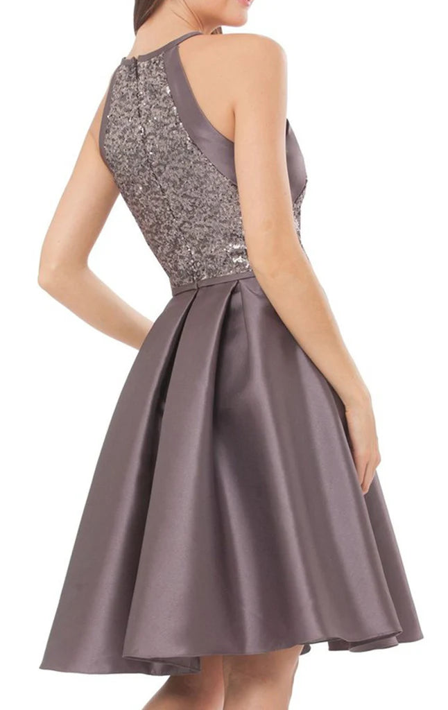 Back view of a woman in a shimmering halter sequin satin party dress.