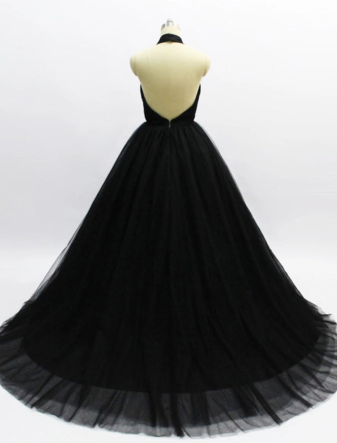 Back view of the halter neck tulle ball gown, showcasing the open back and court train.