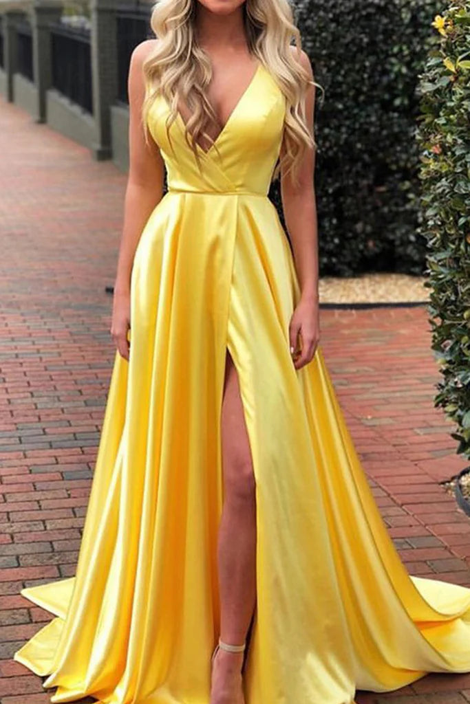 Woman wearing an elegant halter V-neck satin long prom dress.