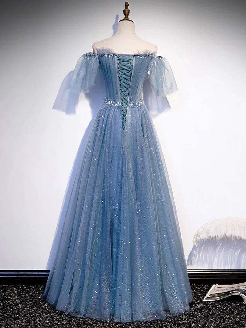 Close-up of the beaded and sequined bodice with flare tulle sleeves.