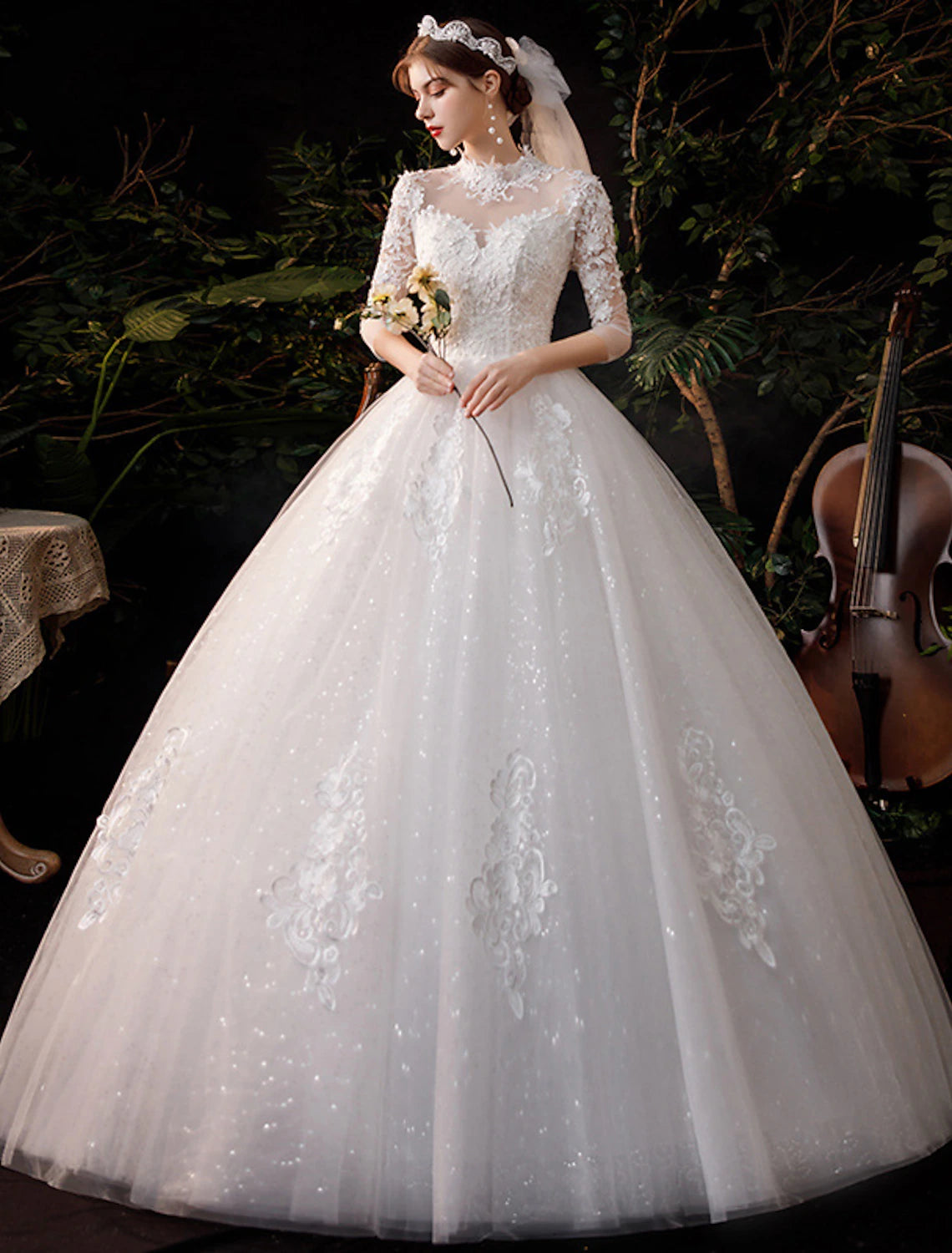 Side view of high neck half sleeve lace ball gown wedding dress.
