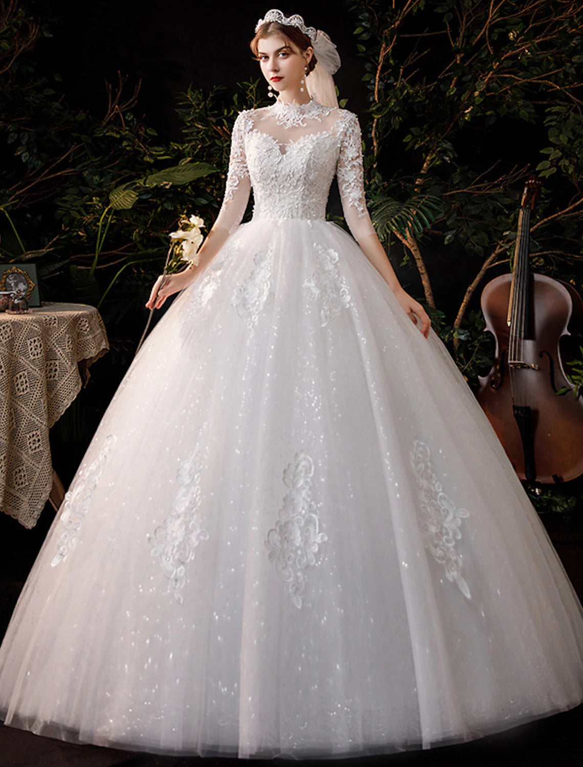 Close-up of lace appliques on high neck half sleeve wedding dress.