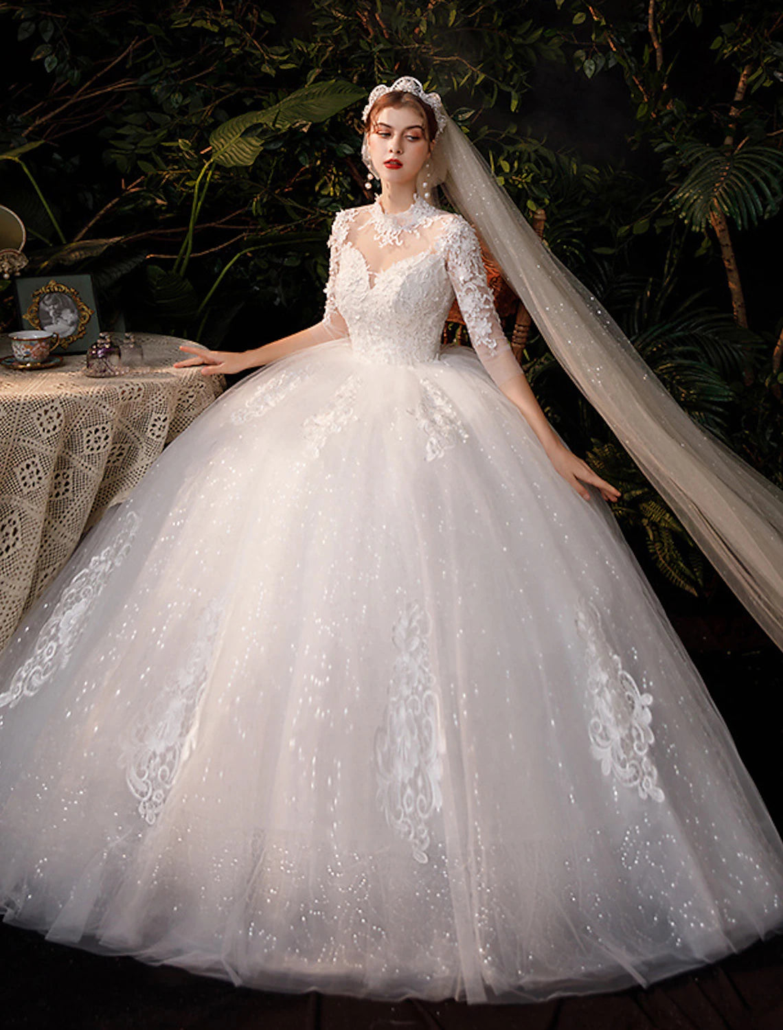 Bride wearing high neck half sleeve lace ball gown wedding dress.