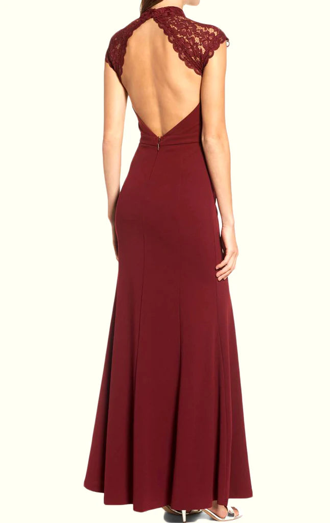 Back view of navy blue high neck lace formal evening dress.