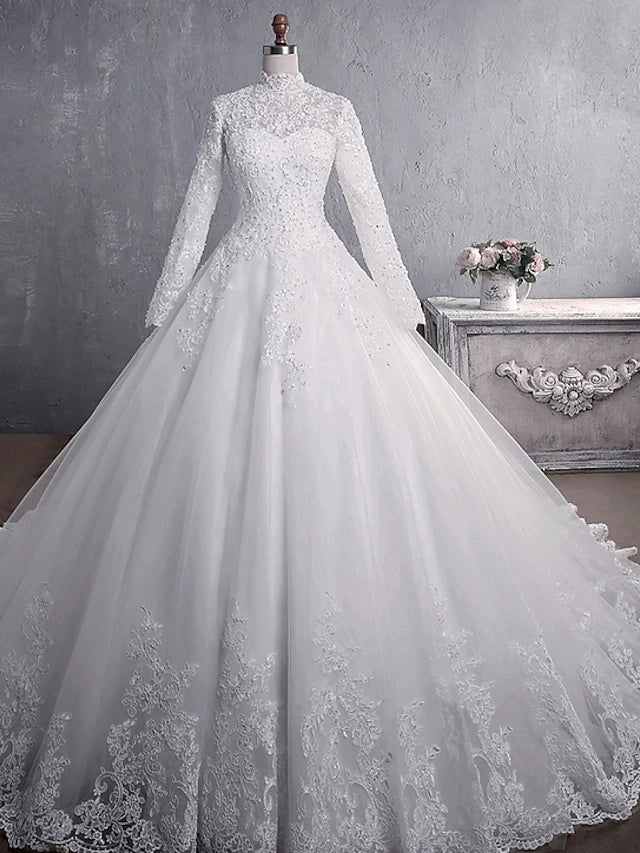 Elegant high neck long sleeve lace ball gown wedding dress.
