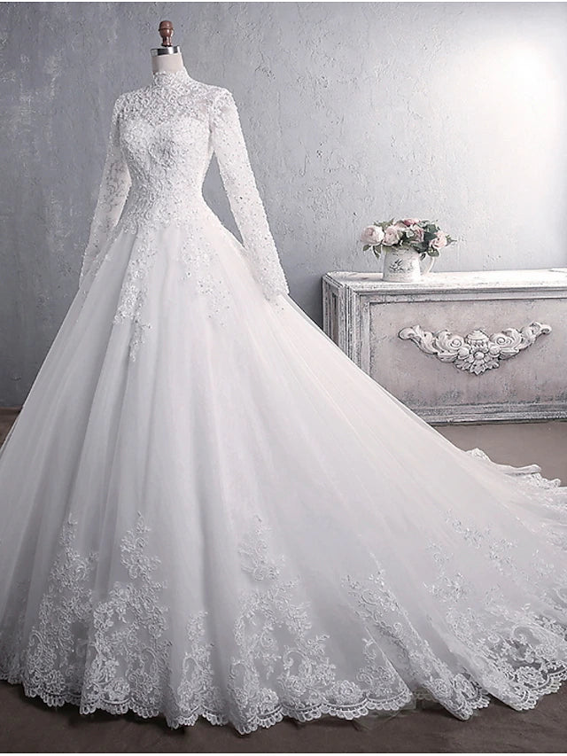 Back view of the formal wedding dress with lace appliques and court train.