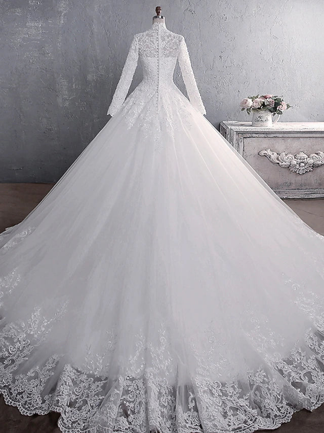 Close-up of intricate lace and applique details on the wedding gown.