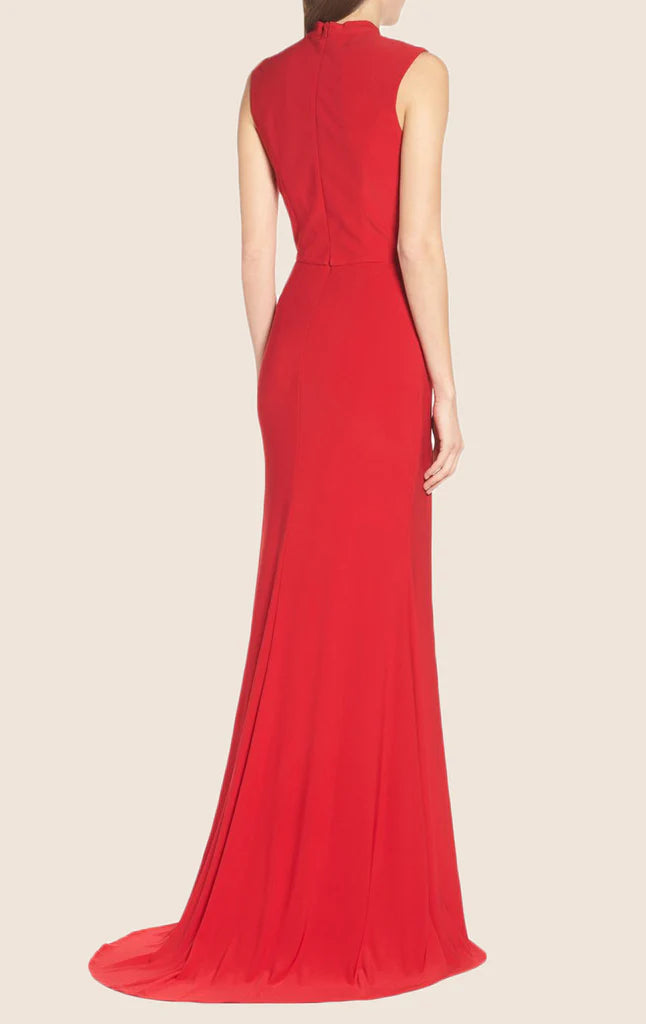Full length view of the formal gown, showcasing its flowing skirt and high neckline.
