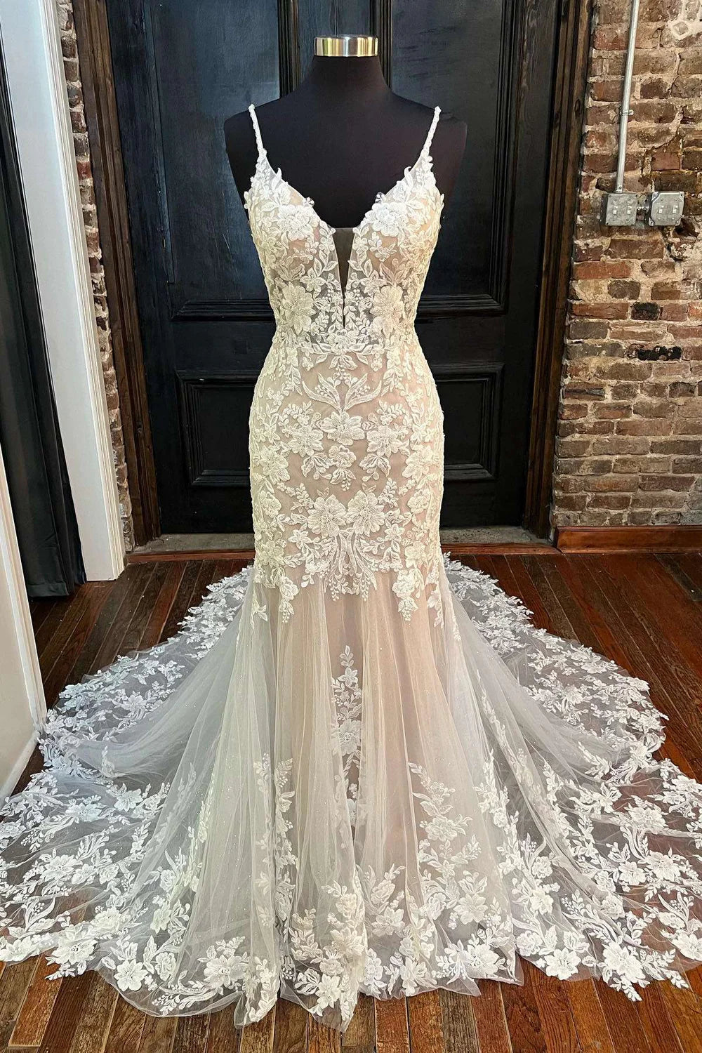 Elegant white trumpet wedding dress with high neck and backless design.