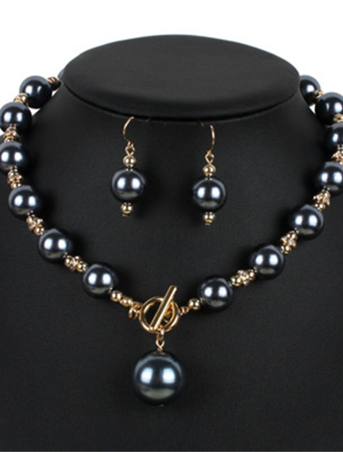 Close-up of the imitation pearl necklace and earrings set.