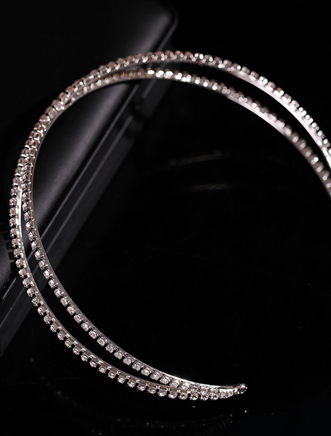 Side view of a sparkling tiara for evening events.