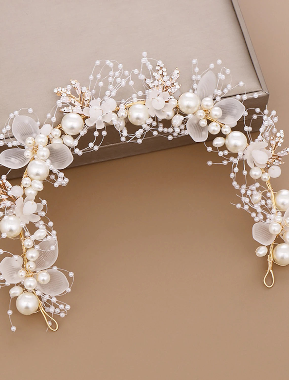 Retro-style crystal and faux pearl headwear for evening.