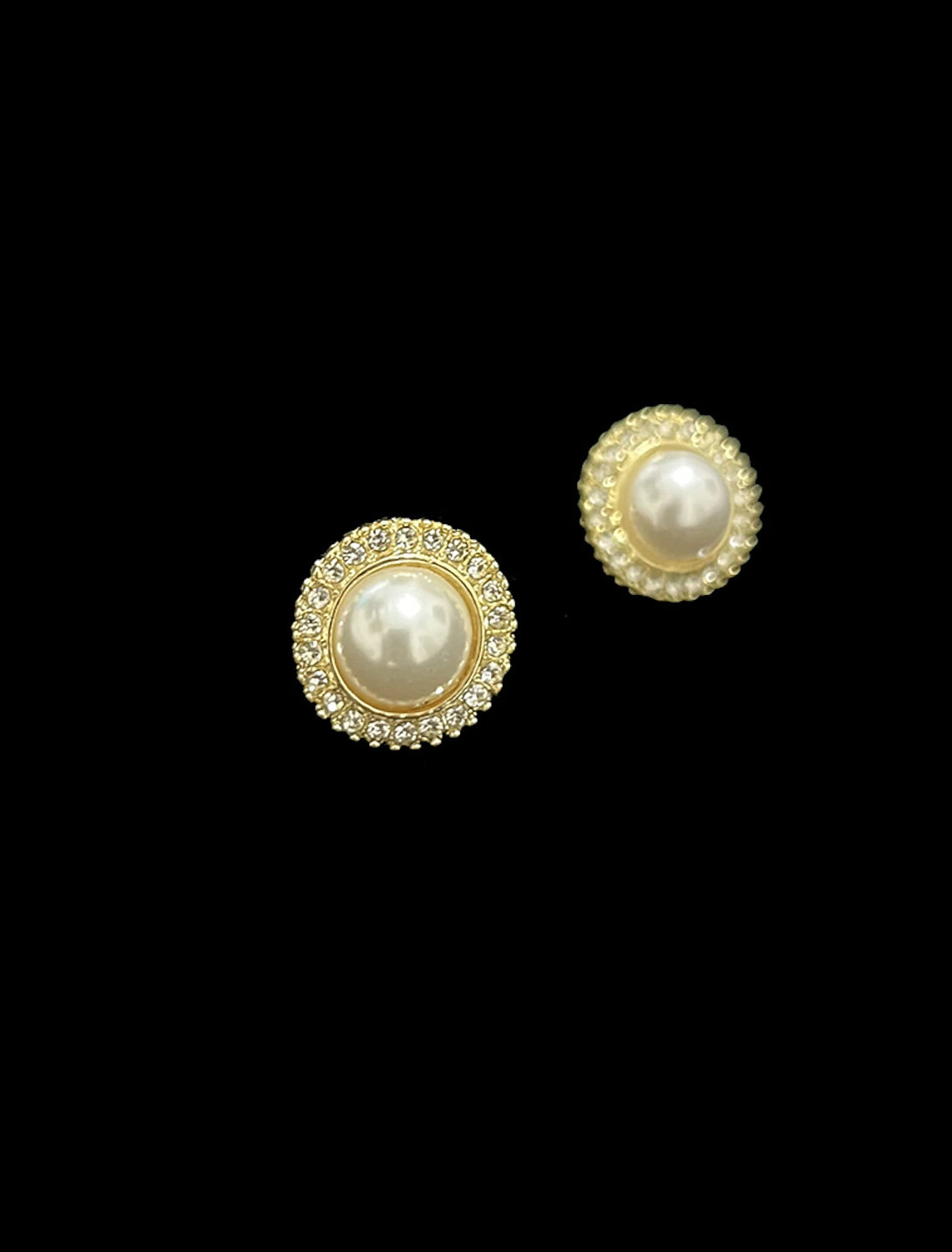 Close-up of the matching imitation pearl and rhinestone drop earrings.