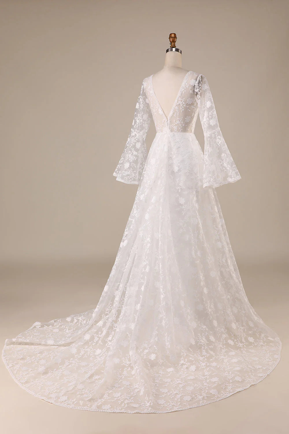 Side view of the ivory A-line wedding gown, highlighting the flowing skirt.