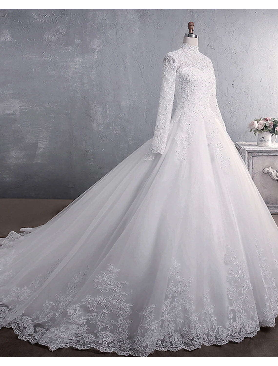 Back view of the wedding dress showcasing its majestic court train.