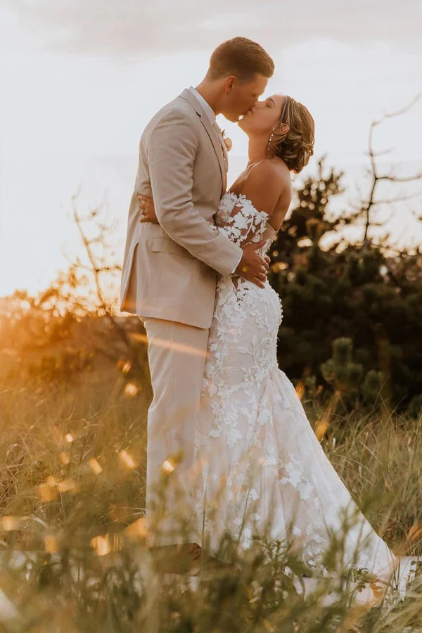 Side view of the ivory mermaid trumpet wedding dress, showing the silhouette.