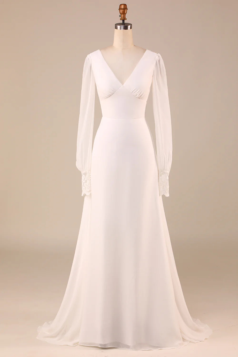 Elegant ivory mermaid wedding dress with long sleeves and open back, front view.