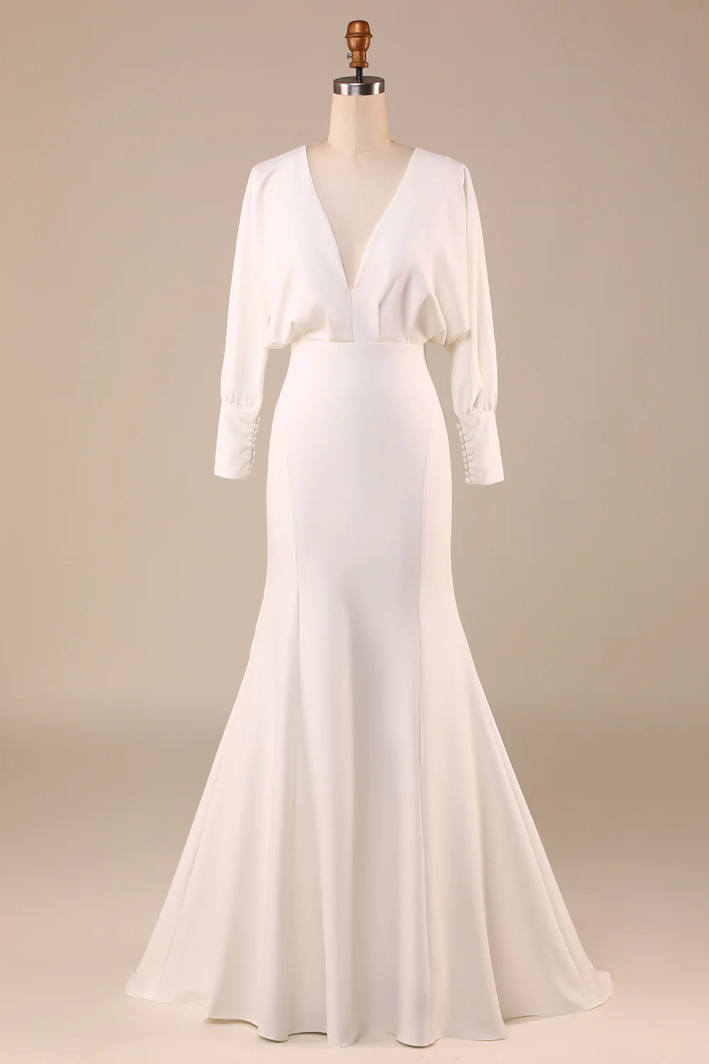 Elegant ivory satin wedding dress with long sleeves and sweep train.