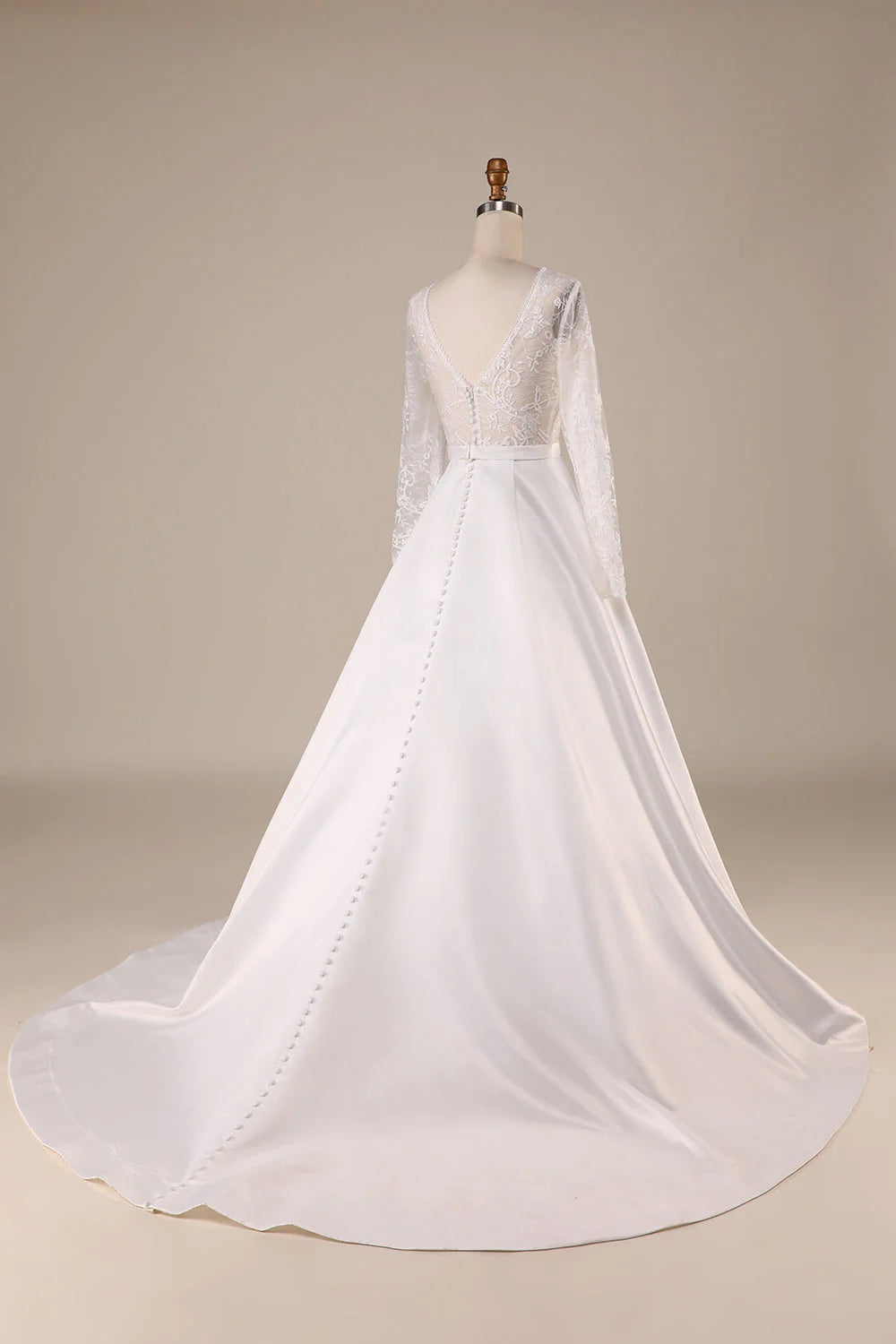 Back view of an ivory satin wedding dress, showcasing the elegant sweep train.