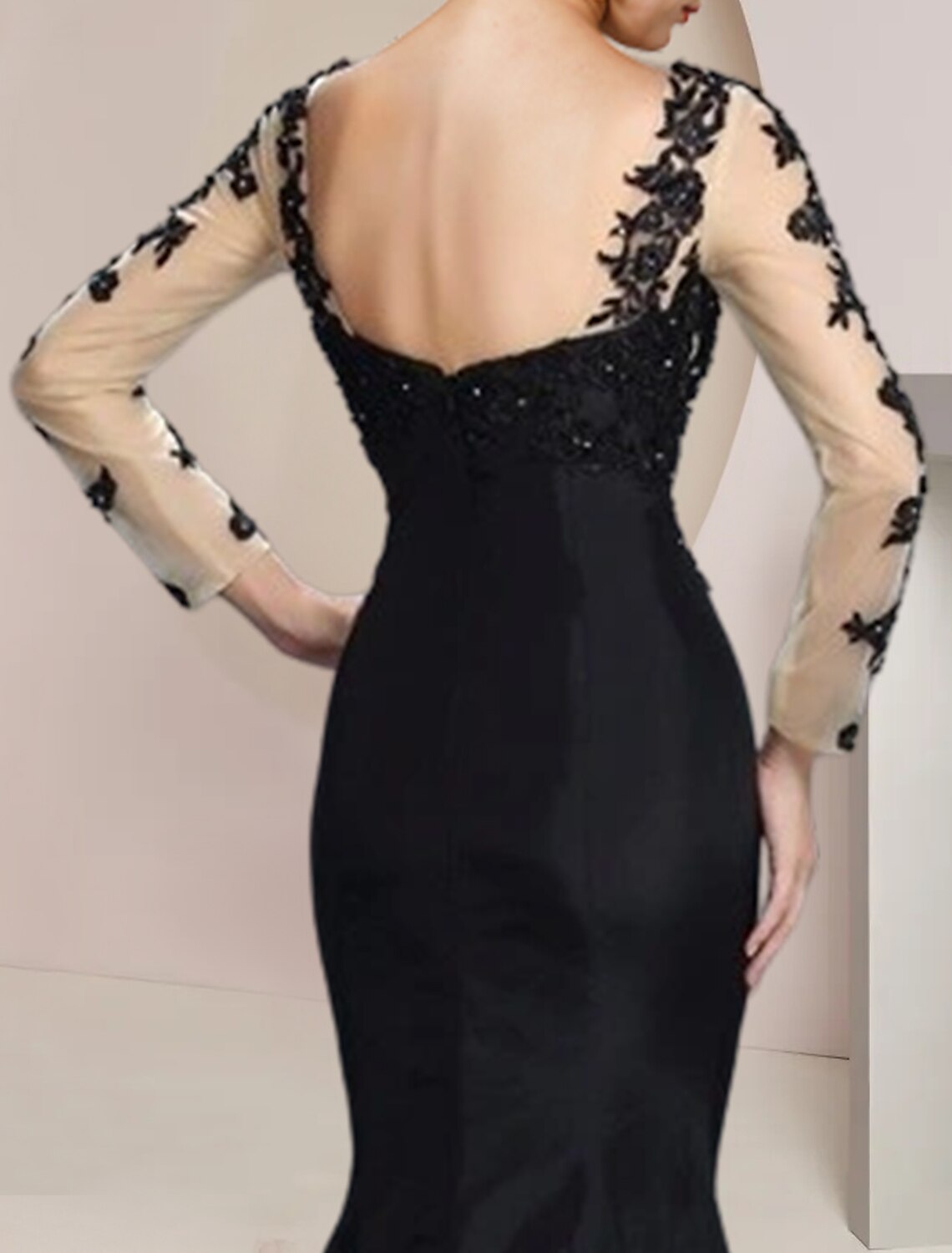 Back view of elegant long sleeve wedding guest dress.