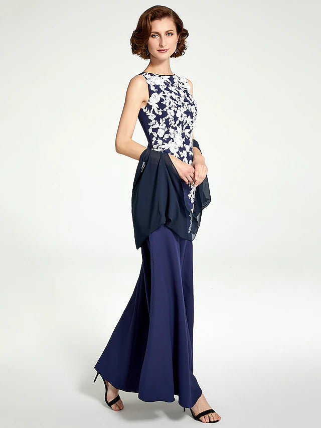 Close-up of the delicate lace and chiffon fabric on the sleeveless dress.