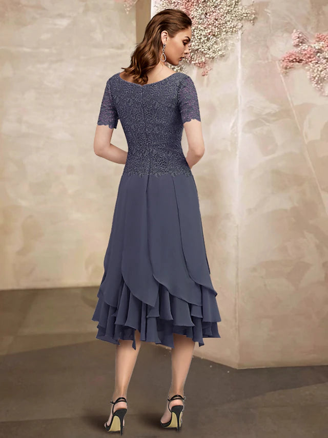 Close-up of the jewel neck and lace details on the short sleeve Mother of the Bride dress.