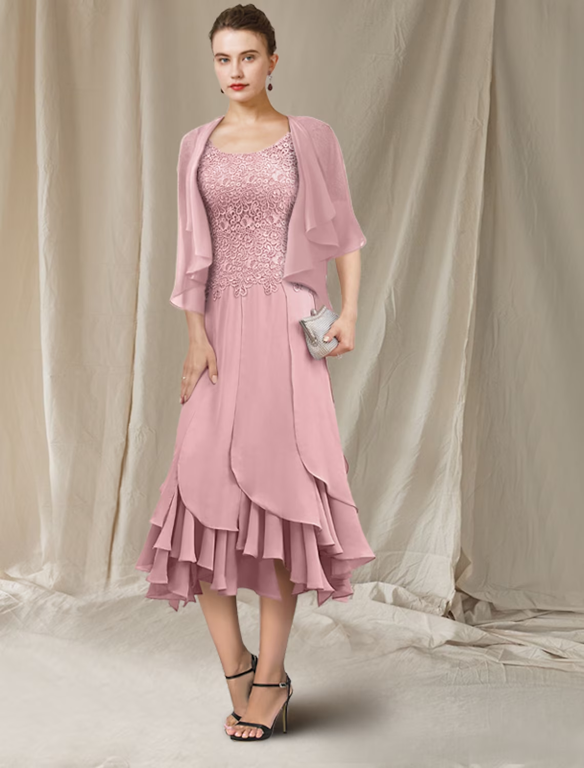 Detailed view of the lace ruffles and chiffon fabric on the Mother of the Bride gown.