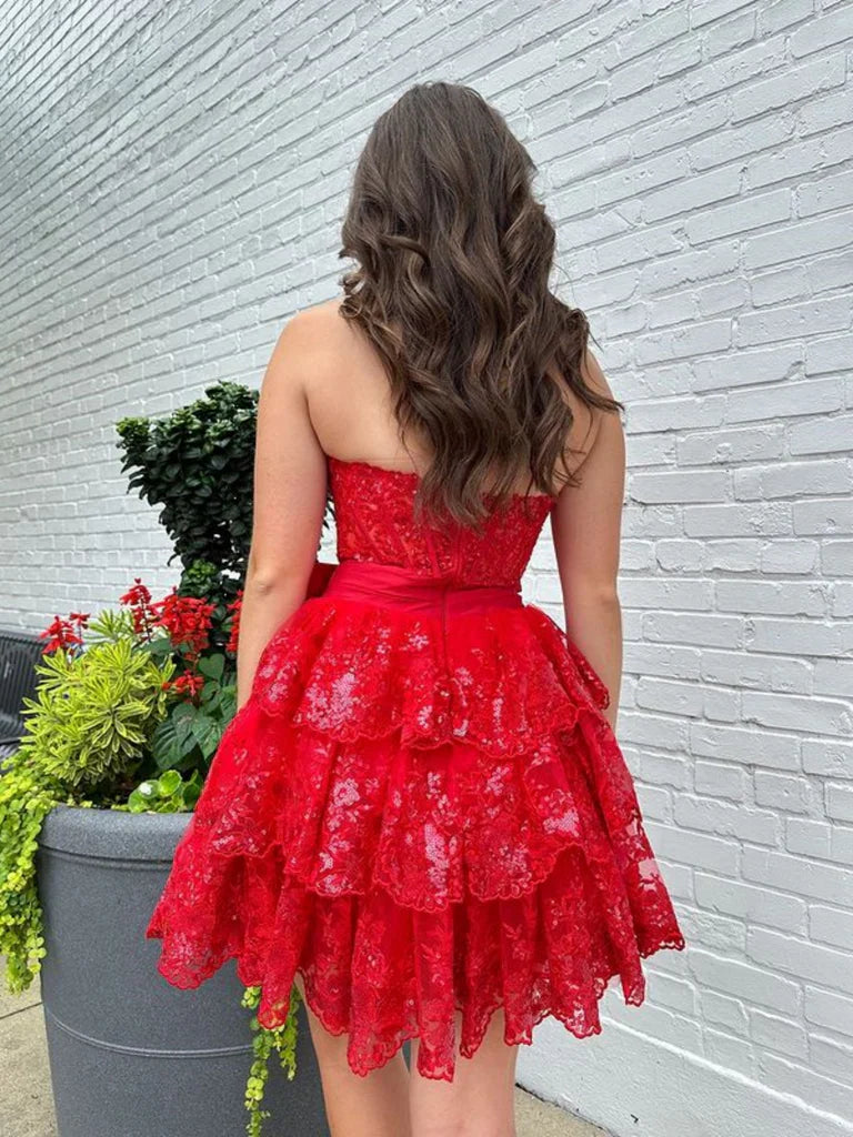Side view of a woman wearing a light blue strapless sweetheart lace A-line formal gown.