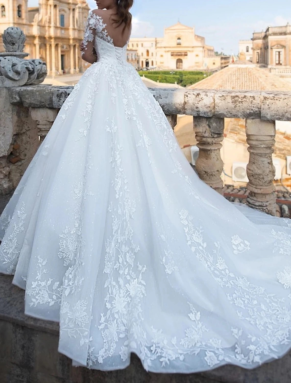 Front view of the V-neck long sleeve ball gown wedding dress.