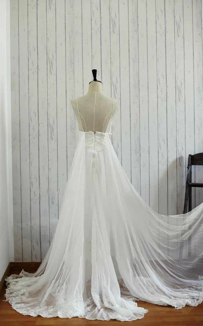 Rear view of lace backless chiffon satin wedding dress showing intricate lace details.