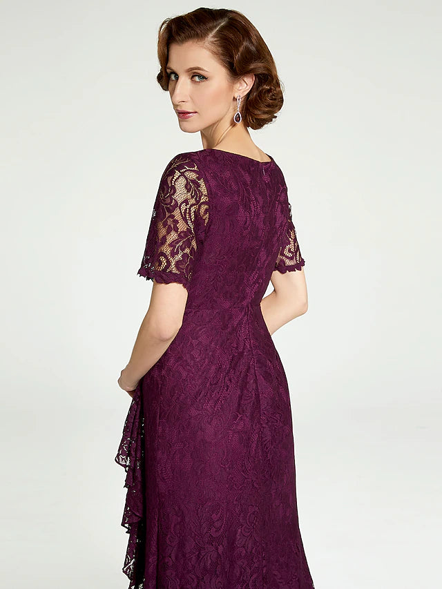 Side profile of the sheath dress, highlighting its graceful silhouette.