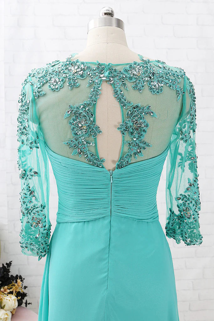 Close-up of the lace detailing and 3/4 sleeves on the Mother of the Bride dress.