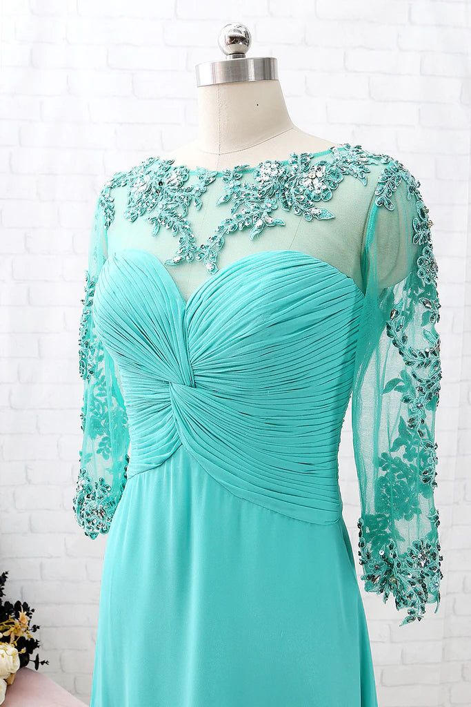 Side profile of a woman in the V-neck lace and chiffon formal dress, flowing to ankle length.