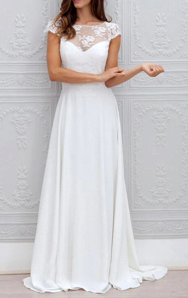 Woman wearing an elegant sleeveless lace and chiffon V-neck maxi prom dress.
