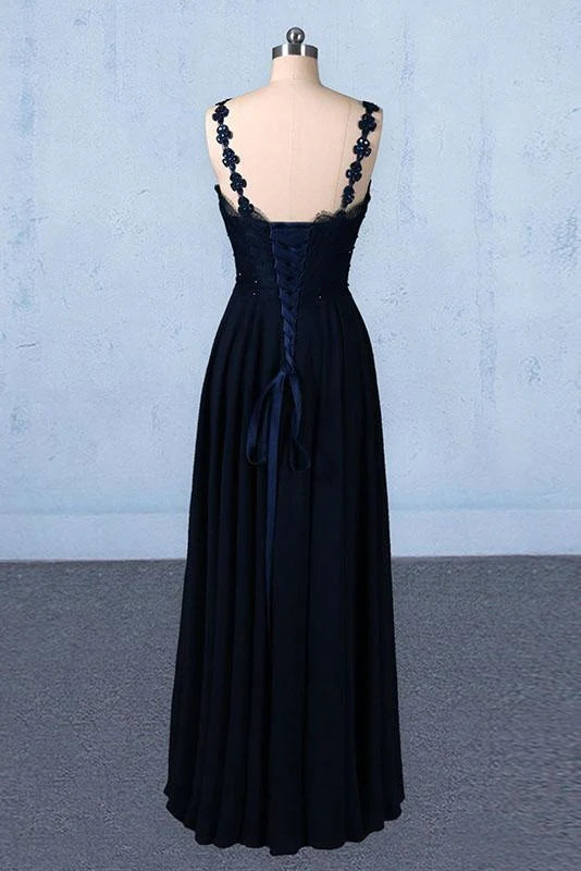 Back view of a formal chiffon gown with delicate lace and flowing skirt.