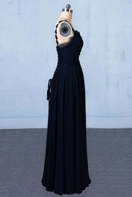 Side view of a woman wearing a long lace and chiffon evening dress.