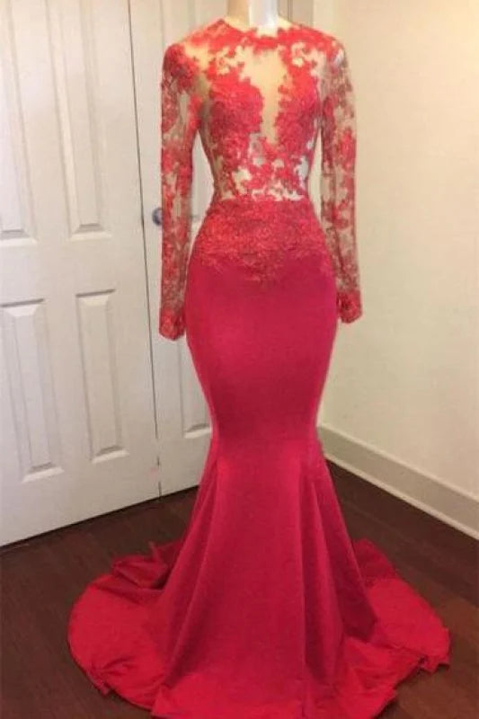 Woman wearing an elegant dark lace mermaid long sleeve prom dress.