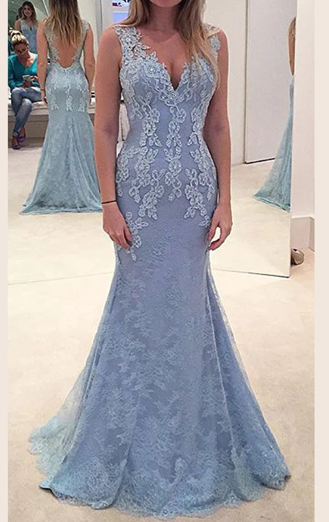Elegant woman in a V-neck lace mermaid prom dress.